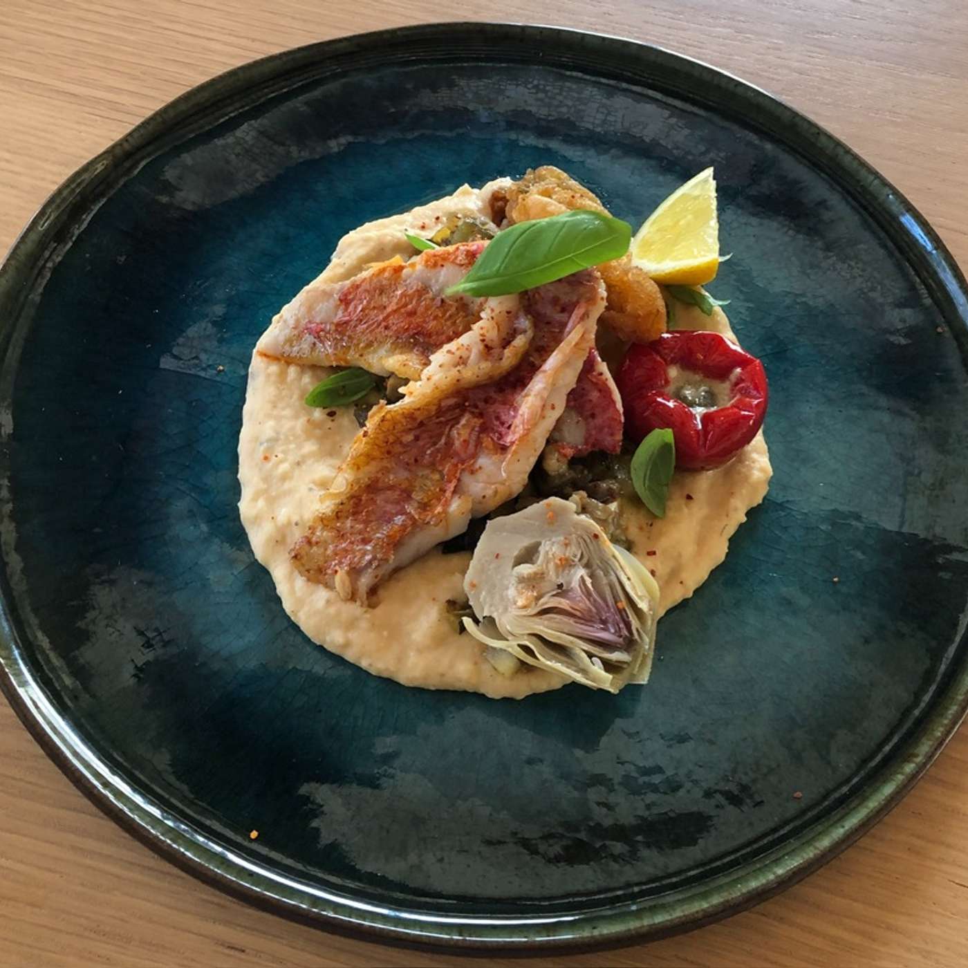 Filet de rouget grillé , beignet de fleur de courgette, poivron grillé, artichaut en barigoule et crémeux de lentilles corail . episode artwork